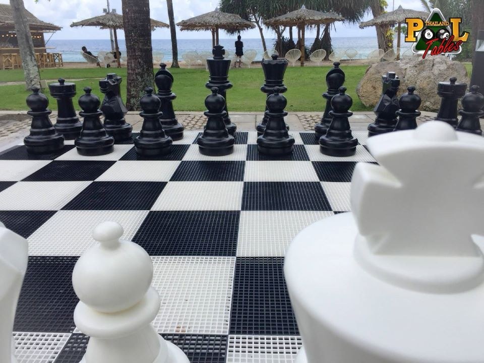 giant chess on plastic mat at merlin beach hotel